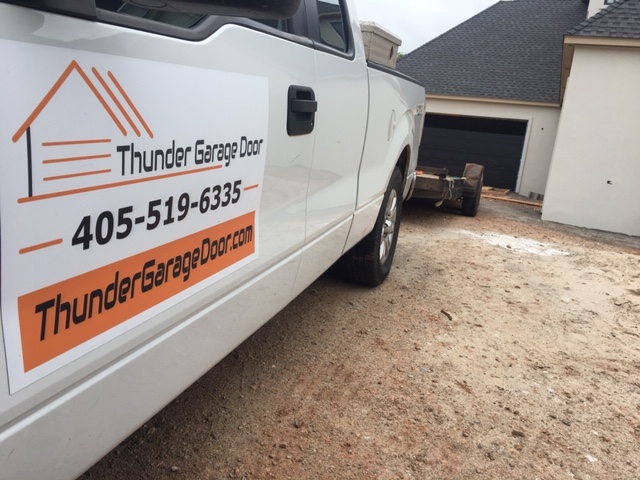 Thunder Garage Door truck at a job site